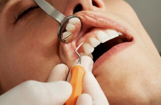 dental tools in patient's mouth | dentistaltamonte.com